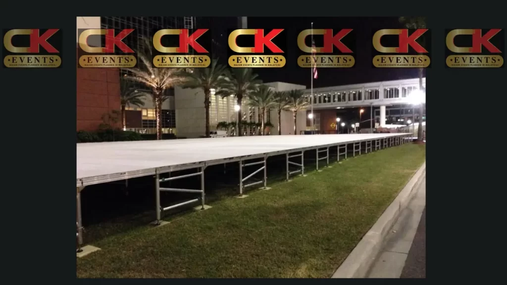Outdoor long straight stage rental on grass for large-scale public events