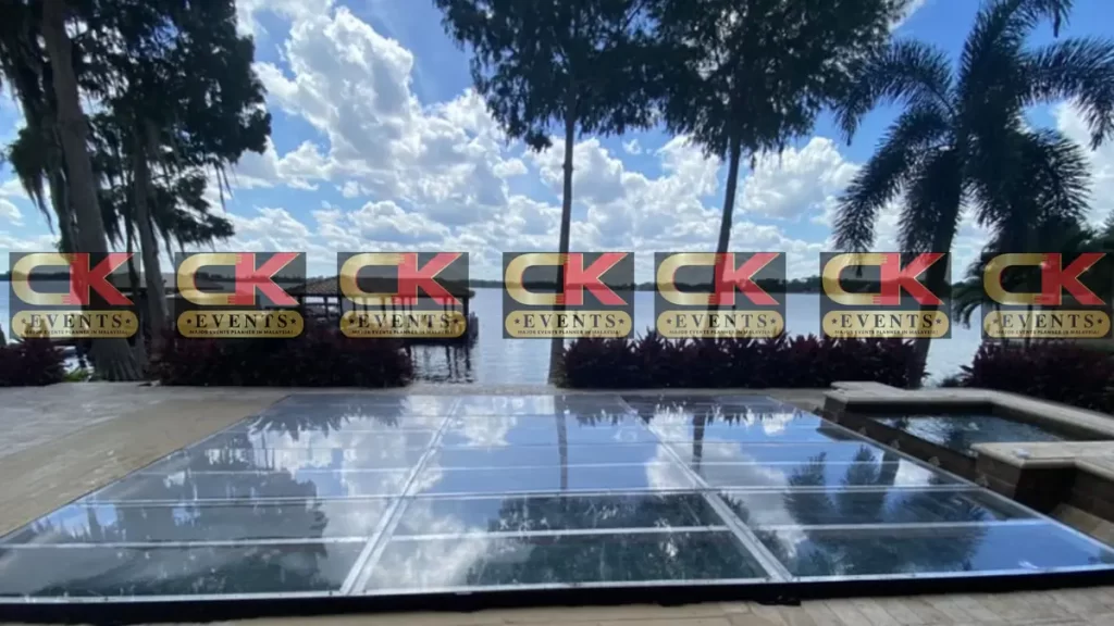 Clear acrylic outdoor stage rental with lakeview backdrop for event production
