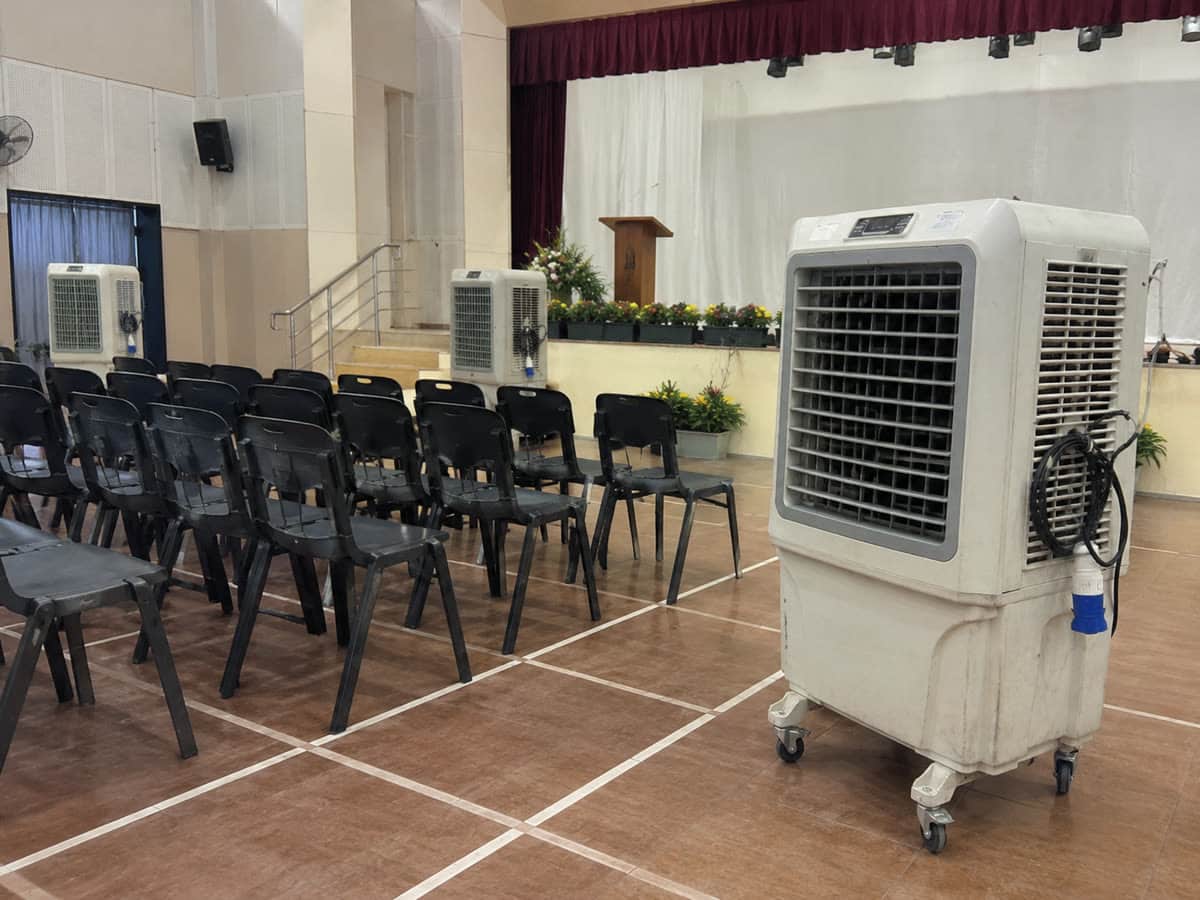 Air cooler rental school hall Kuala Lumpur dewan event with chairs and stage