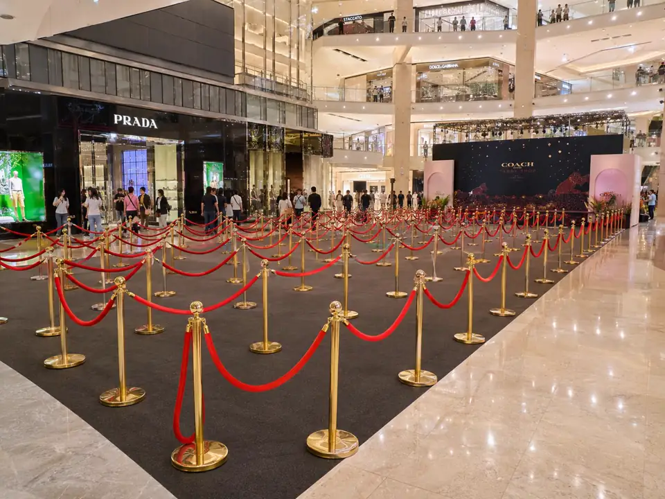 Gold Q pole with red belt large queue system inside Bukit Bintang luxury shopping mall