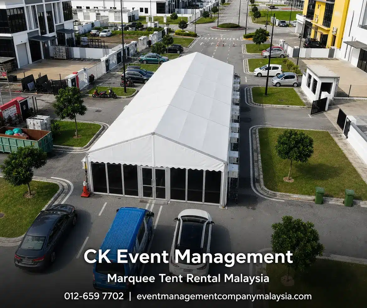 Aerial road marquee setup with long white tent in a commercial area
