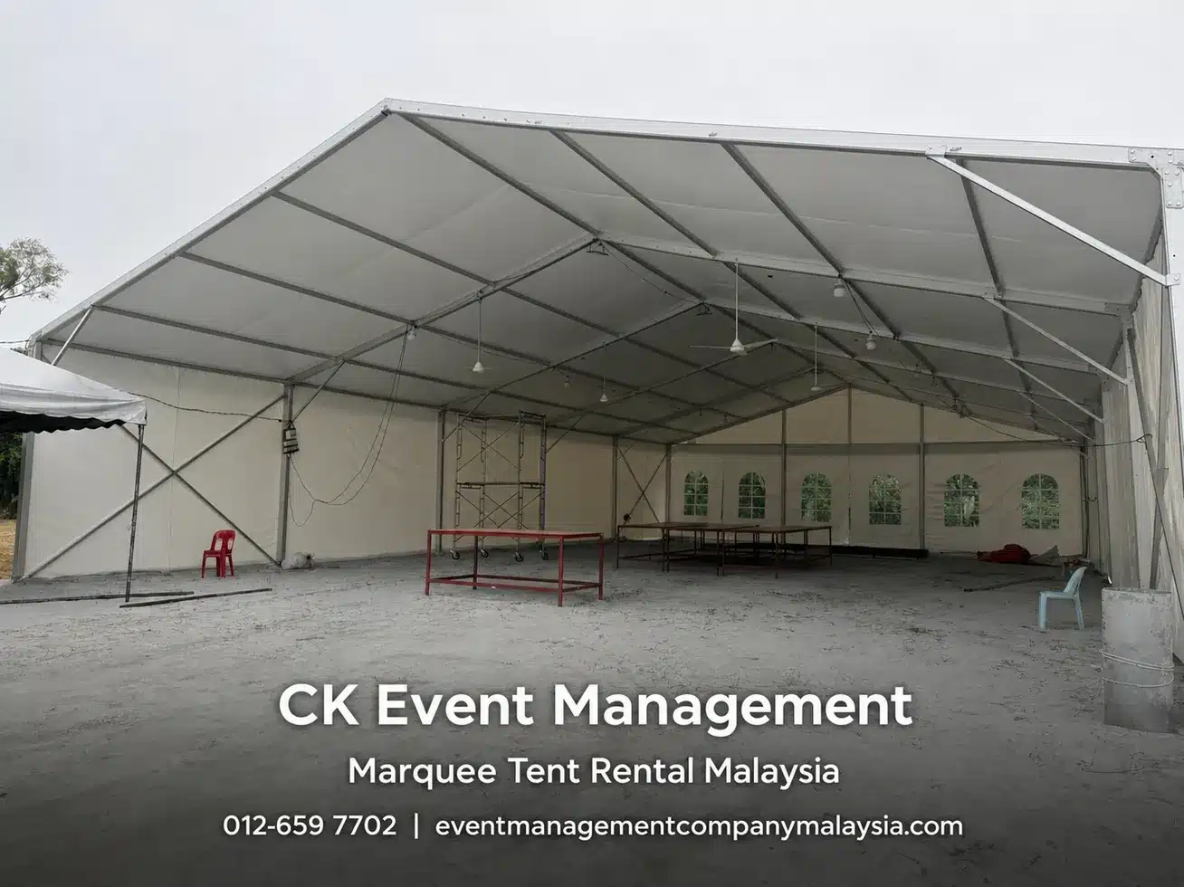 Large clear span marquee tent exterior with CK Event Management branding