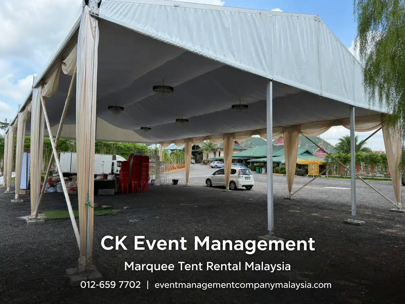 Clear span marquee side view with beige side drapes and open event area