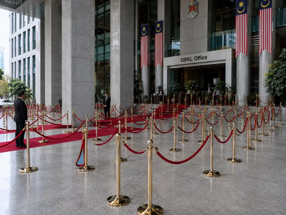 Grand DBKL office entrance with gold Q poles and red belts arranged for VIP crowd control