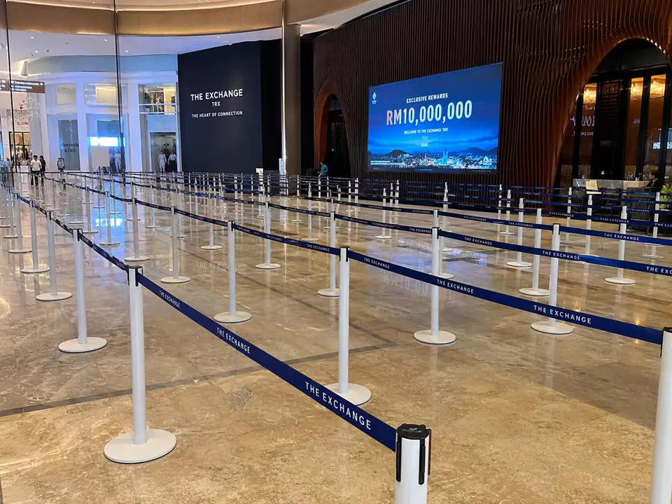 White Q pole with blue 2 meter belt large queue deployment at The Exchange TRX shopping mall