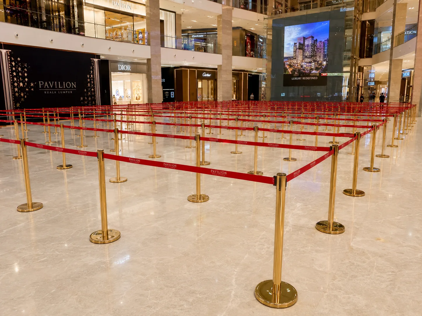 Gold Q pole with red 2 meter belt large deployment for luxury mall event at Pavilion Kuala Lumpur