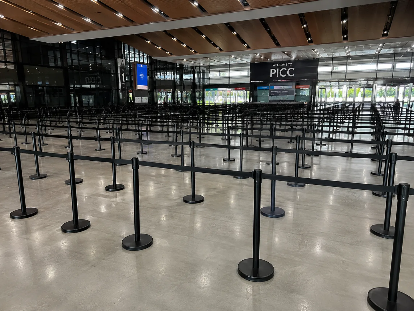 Large black Q pole with black belt deployment at Putrajaya International Convention Centre for event crowd control