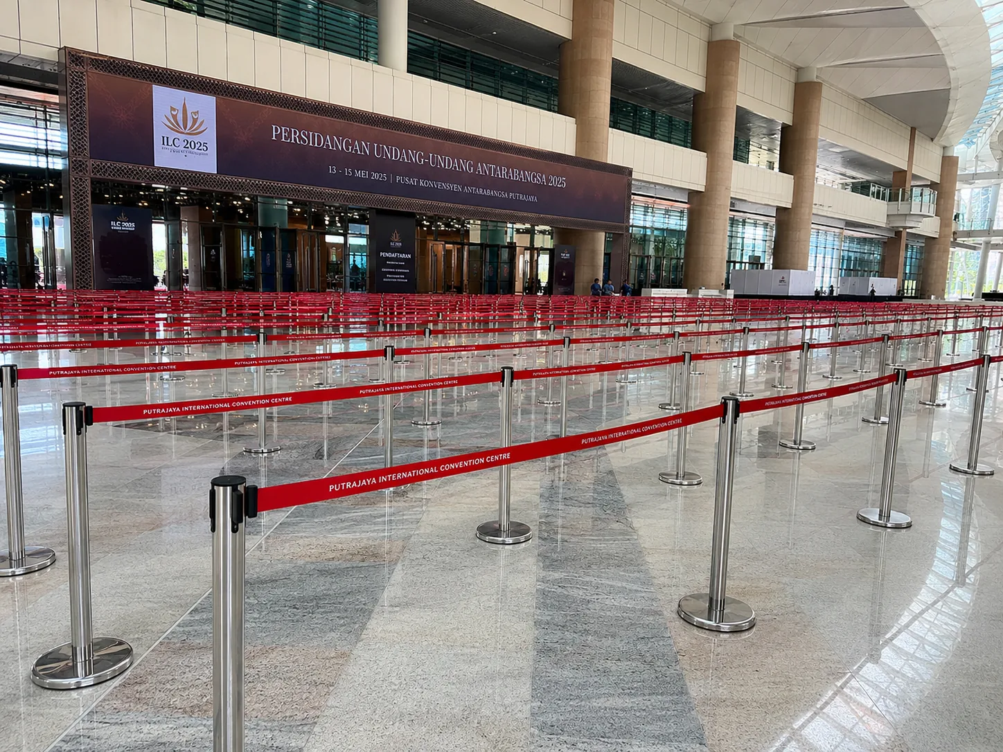 Silver Q pole with red 2 meter belt arranged in a large registration queue at Putrajaya International Convention Centre