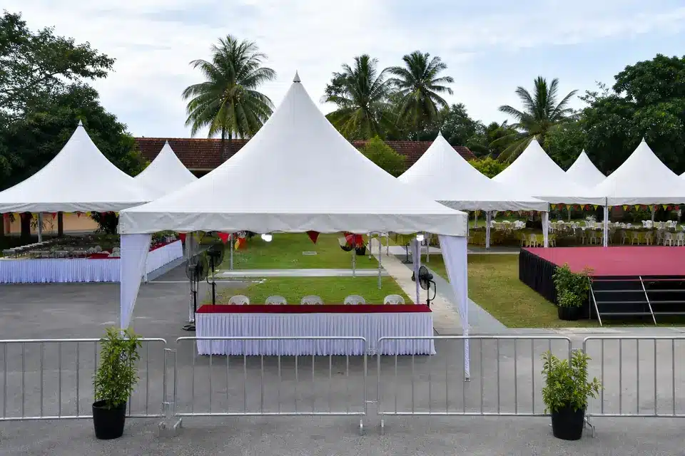 Pyramid event canopy sample in Malaysia with multiple pointed tents, registration table and public event layout