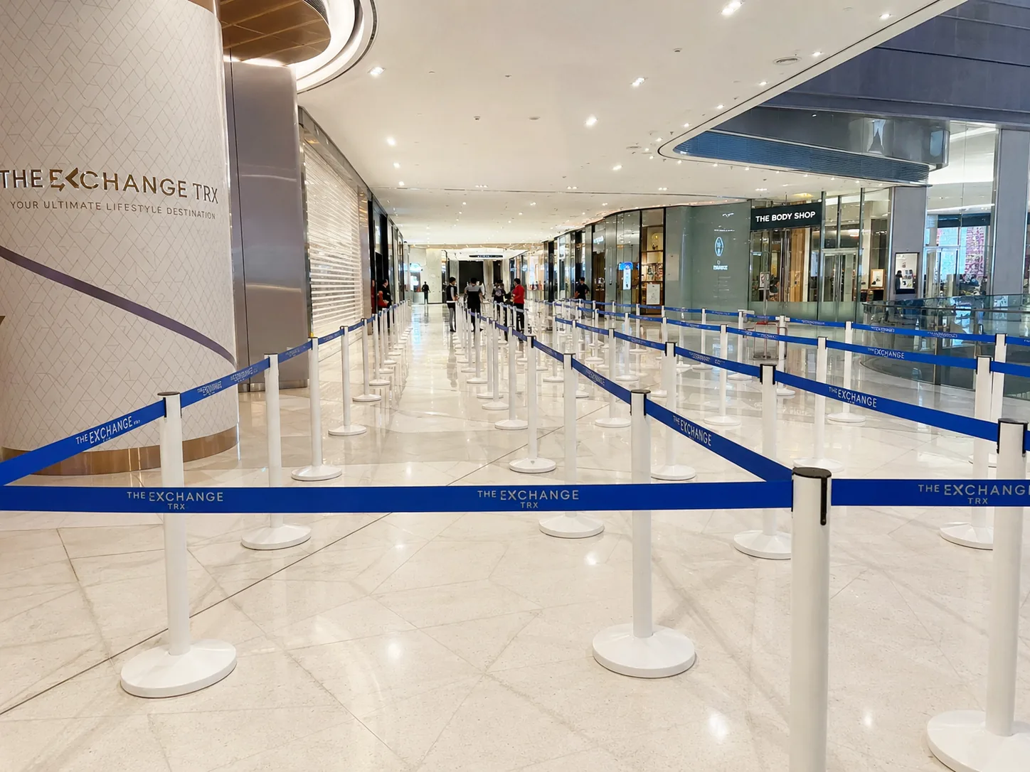 Black Q pole with black belt large crowd control queue setup in a modern Malaysian shopping mall
